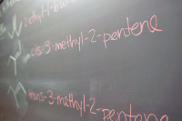 Chemistry terms written on a chalkboard