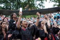 Students standing and cheering during convocation