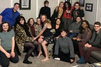 M. Paz Galupo, seated on couch fourth from right, with their students. The lab is devising new scales to capture the experiences of gender and sexuality minorities more fully.
