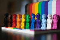 A colorful array of Lego figures arranged in the colors of the rainbow. Photo by James A. Molnar on Unsplash.
