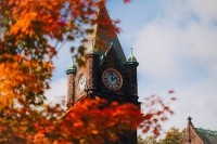 Mount Holyoke College clock tower highlighted by red leaves in the fall of 2024. Photo by Max Wilhelm.