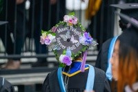 Mount Holyoke student decorated their mortarboard with the words Mount Holyoke Forever Shall Be and flowers