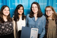 Mount Holyoke News staff pose with their prize for excellence in programming (from left): Zoe Zeligman ’19, Risha Dewan ’18, Lindsey McGinnis ’18 and Emily Blomquist ’18.