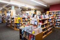 Odyssey bookshop, shelves filled with colorful books.