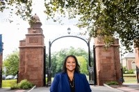 President Danielle R. Holley in front of the Mount Holyoke gates during move-in