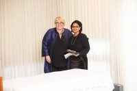 Suparna Roychoudhury (right), associate professor of English, accepted the Meribeth E. Cameron Faculty Award for scholarship from President Sonya Stephens in 2020.