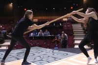 D&amp;D comes to life in the play “She Kills Monsters”: Kaliope (Adelia Brown ’22, left) uses the quarterstaff to knock out Farrah the Faerie (Ezri Braid-Grizzell ’23) so she can move forward in the adventure.