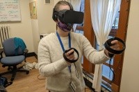 Stephanie Friedman, instructional technologist and specialist in emerging technologies for LITS, demonstrates the VR headset.