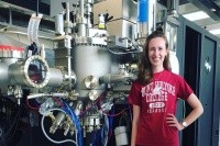 Margaret Stevens next to machinery.