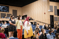 Students preparing to ask questions at the After Roe panel discussion