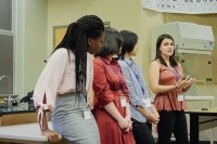 Students presenting information at a scholarship conference at Mount Holyoke College