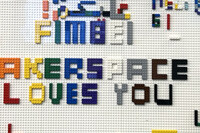 The words Fimbel Makerspace Loves you written with Legos