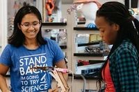 Students in a science lab working on a project together at Mount Holyoke College.