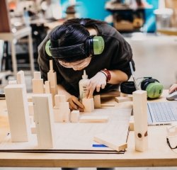 fimbel-lab-woodwork.jpg A student works on a wood project in the Fimbel Lab