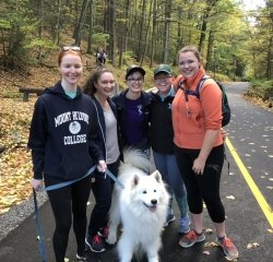 seniors-mountain-day-2018.jpeg A group of seniors and a dog enjoying the hike on Mountain Day 2018