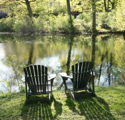 Adirondack chairs on the shore by Lower Lake