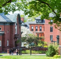 Campus Center from between two trees. Photo taken by Ryan Donnell May 2017.