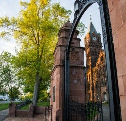 Image of the Gates, clock tower in the background.