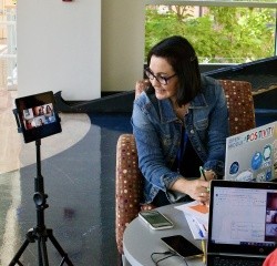 Professional and Graduate summer 2022 students in a small group discussion both in person and online.