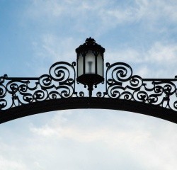 Gates and a blue sky with slight clouds. Photo taken by Ryan Donnell, 2017.