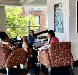 Professional and Graduate students in a discussion group with the instructor.