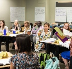 MATM students engaged in a discussion in the classroom