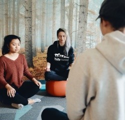 Students meditating in the Moasis space