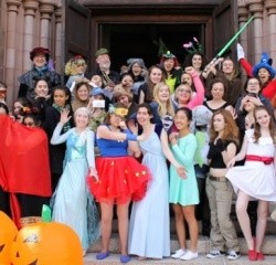 A group of students in costumes outside Abbey Chapel