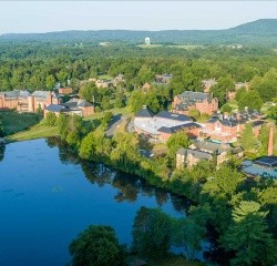 The Mount Holyoke Campus seen from above, with Lower Lake in the foreground and rolling hills in the background