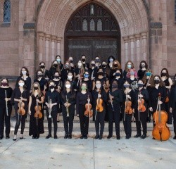 Members of the Mount Holyoke Orchestra on the steps of Abbey Chapel