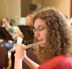 A student playing the flute