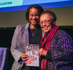 President Holley poses with Judy Richardson and book "Hands on the Freedom Plow", 2025.