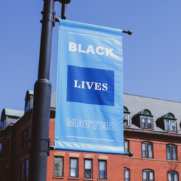A Black Lives Matter sign hanging on a lamp post on the Mount Holyoke campus