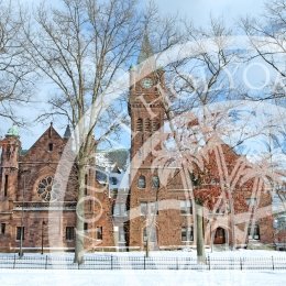 Mary Lyon Hall in winter with the College seal overlay