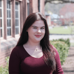Klara Grygo ’23 standing outside on the Mount Holyoke College campus
