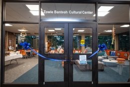 The doors to the Zowie Banteah Cultural Center, adorned with a blue ribbon to mark the grand opening of the new location