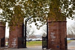 The Gates of Mount Holyoke framed by leaves starting to turn colors.