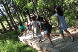 Students walking on the living lab boardwalk
