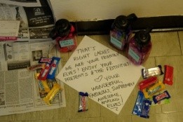 Photo of elfing gifts outside a door