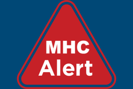 The words MHC Alert written within the outline of a red triangle