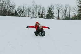 Students sledding on campus