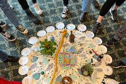 Lauren Gaia, Now A Restorative Justice centerpiece is shown with a collection of talking pieces.
