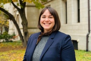 Anne Taylor (a woman wearing dark blue with short brown hair)