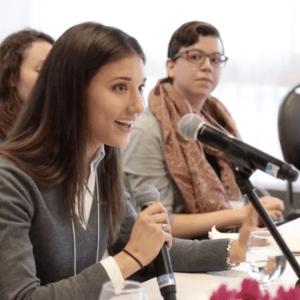 A student answering a question during a panel discussion