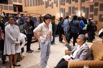 Barbara Smith ’69, speaks with a student