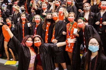 Students cheered in support of their classmates, waved pom-poms, performed the wave and dressed in their class colors. Seniors wore regalia topped with red hats, berets and boas in honor of the red pegasi.