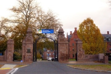 Mount Holyoke College's Gates draped with a banner celebrating International Education Week