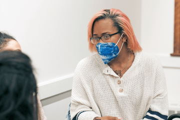 Dr. Kristie Ford in conversation with students