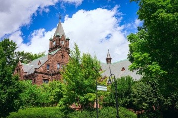 Clocktower in the Mary Lyon building on Mount Holyoke College's campus. Photo taken by Max Wilhelm, summer 2024.