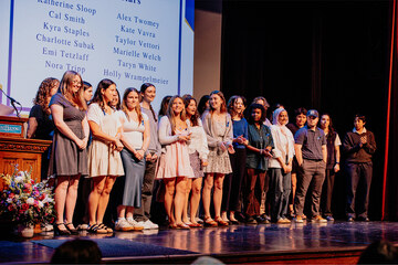 2026 Leadership and Service award winners on stage.